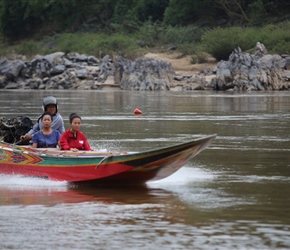High speed boat passes us on the Mekong