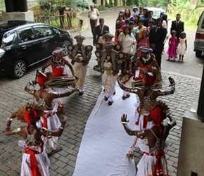 Dancers welcome the groom at the Deer Park Hotel