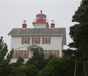 Yaquina Bay Lighthouse, located on the north side of Yaquina Bay. In 1871-1874, it was the busiest and most populated of the many coastal ports between Washington and California