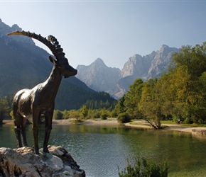 Goat statue overlooks the mountains