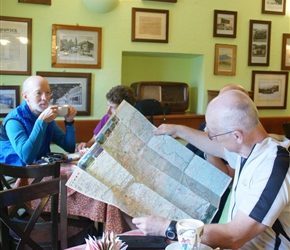 Phil checks the map in the cafe in Vipava