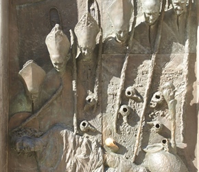 Bronze sculpture of bishops by Marko Mitic on a door on the Cathedral of St. Nicholas in Ljubljana in Slovenia in Eastern Europe