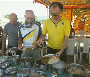Richard, Tom and John help themselves to curry at lunch