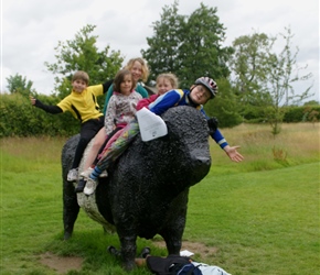 Christopher, Morgan, Ariane, James, Louise and Matthew on a Galloway cow at Threave
