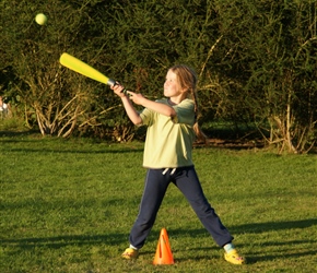 Louise hits the ball at the annual rounders game