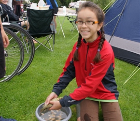 Lucy with a small carp at the campsite. I have no idea where it cane from