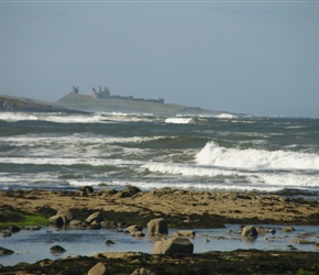 Beach and Dunstanburgh Castle from the off road section of Sustrans route 1