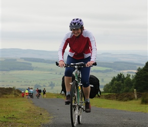 Clare arrives at the top of the Ros Castle climb