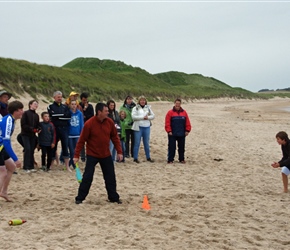 Andy takes strike at the Rounders match on Dunstanburgh Beach