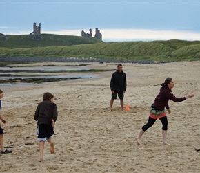 Sarah pitches whilst the Turnpenny's and Dunstanburgh Castle look on