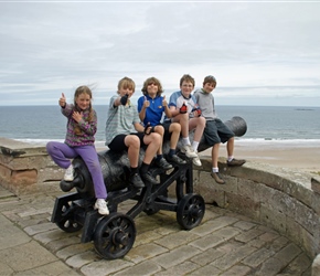 Louise, Bill, Christopher, James and Matthew on a cannon at Bamburgh Castle