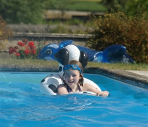 Abbie takes a dip. Lots of inflatables in this pool