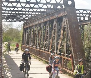 The Evans family crosses the old railway bridge on the Stratford Cycleway