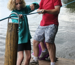 Neil helps Freya pull the raft across the lake at the Otter Centre