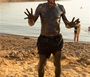 Steve takes a Mud Bath at the Dead Sea. Supplied in tubs by the shore, it's supposed to heal the skin