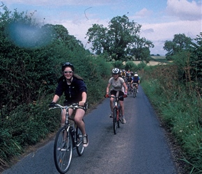 Sarah Mitchell cycling towards Fountains Abbey
