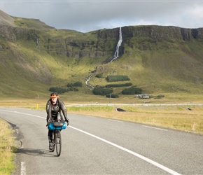 Rachel starts the climb towards Snæfellsjökull National Park with Bjarnarfoss behind