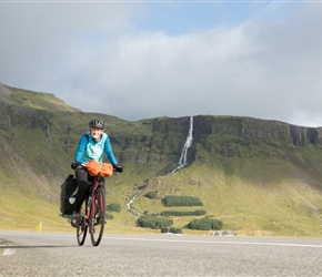 Sharon starts the climb towards Snæfellsjökull National Park with Bjarnarfoss behind