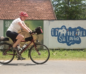 Linda passes a welcome to Sri Lanka mural