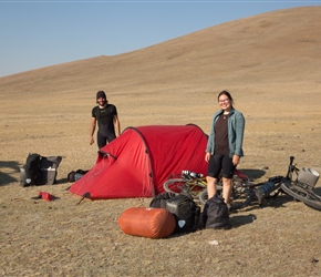 Lorenzo Barone and his wife Aigul pack up their Hilleberg tent after staying the night