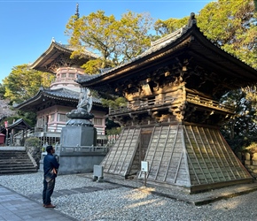 Kiyoshi admires Hotsumisakiji Temple, which we visited by van after the ride was finished