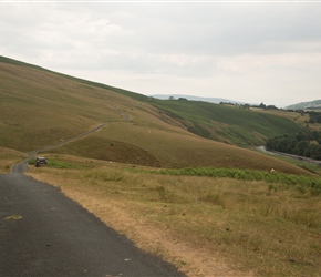 The lane snakes to the left along an exposed part of the valley