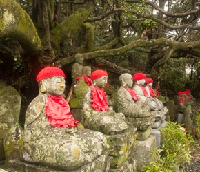 Buddhas with hats and bibs to eep them warm