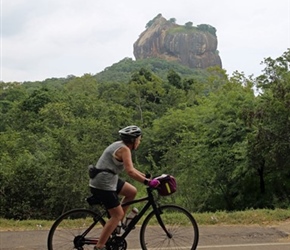 Janet Ellis cycles past Sigiriya Rock Fortress